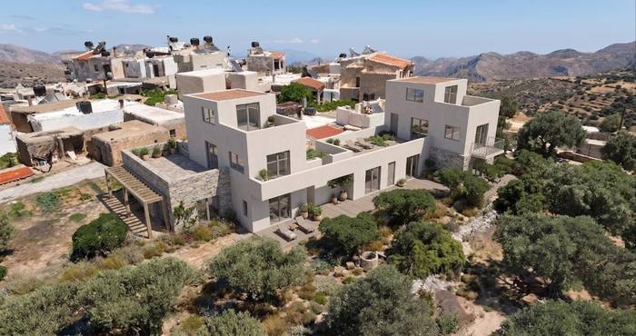 Stone and white villas in a Greek hillside village
